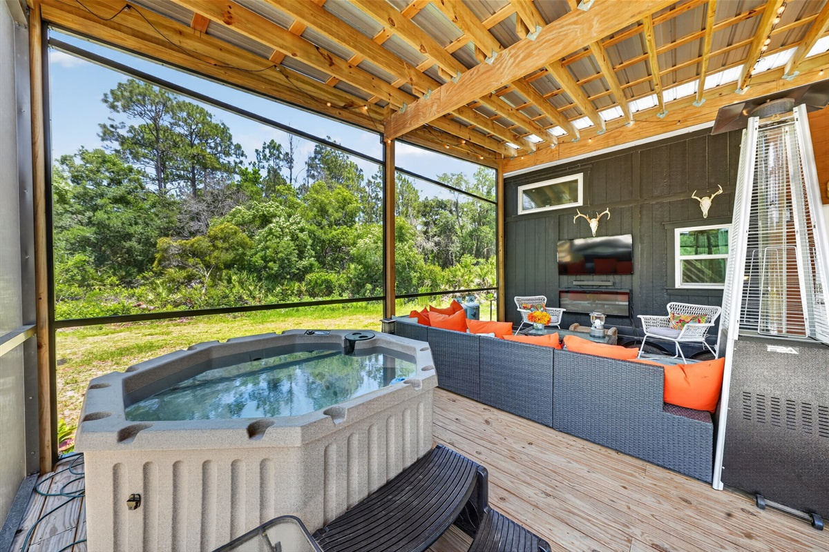Casa Caliente opens onto a big screened porch with its own hot tub.