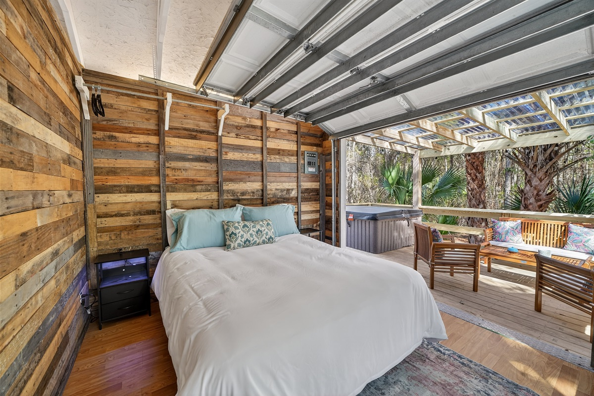 Casa Gaucho — queen bed in a reclaimed wood interior.