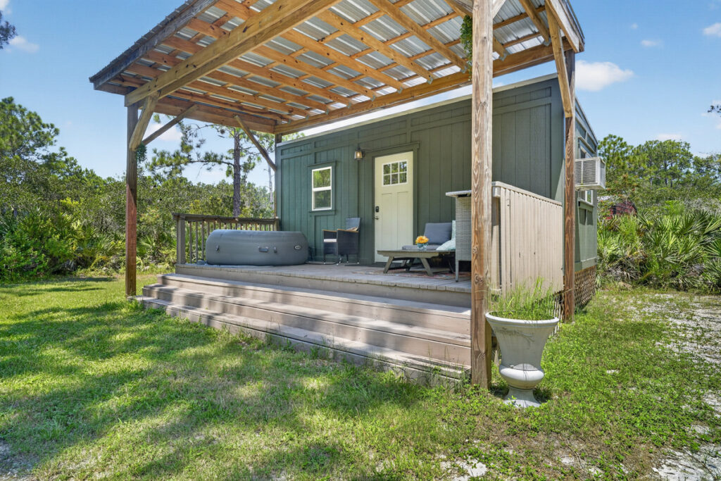The whole cabin is yours — private deck, hot tub, and pines all around
