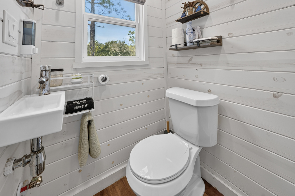 Vanity, fresh towels, and bath storage